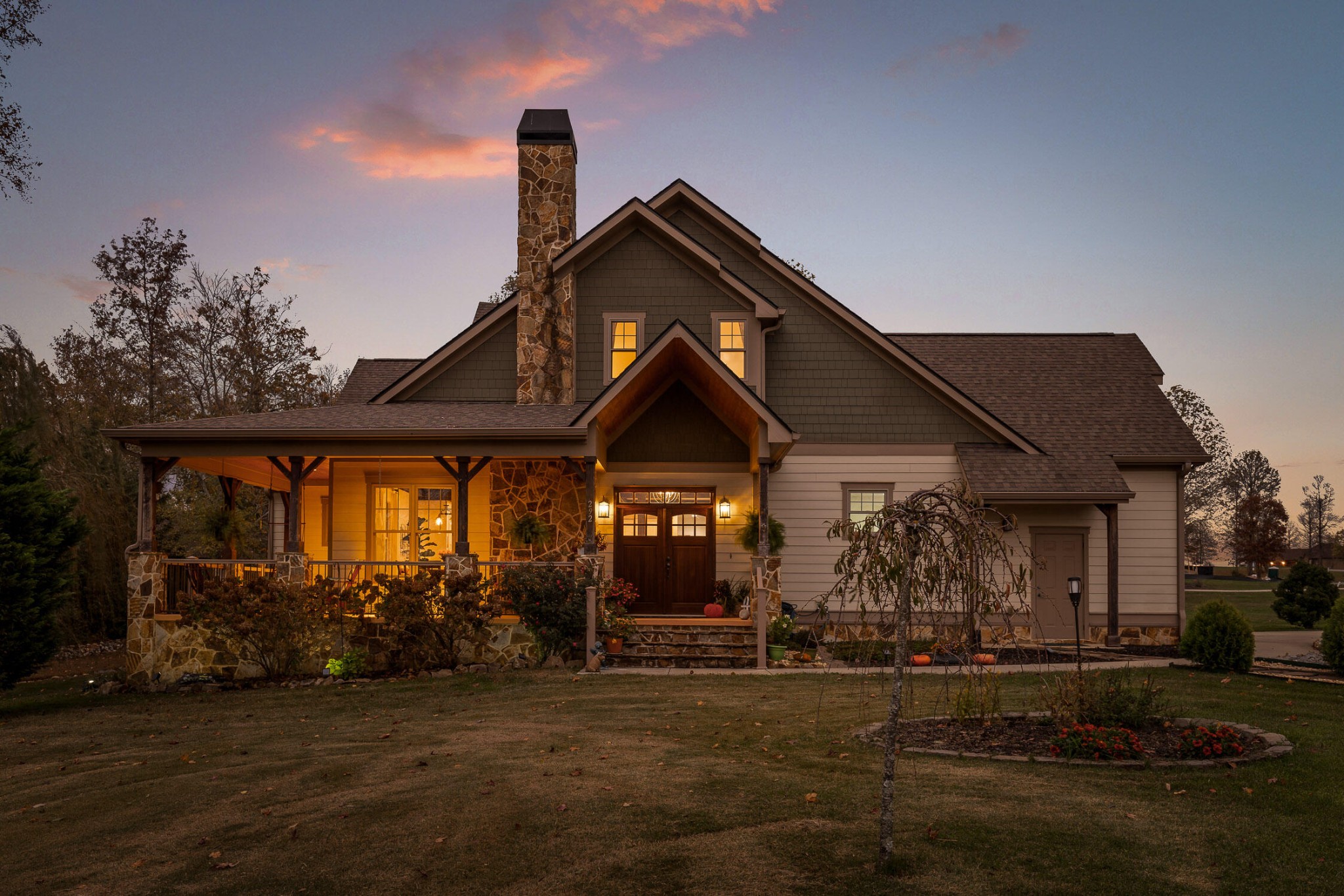 a front view of a house with garden