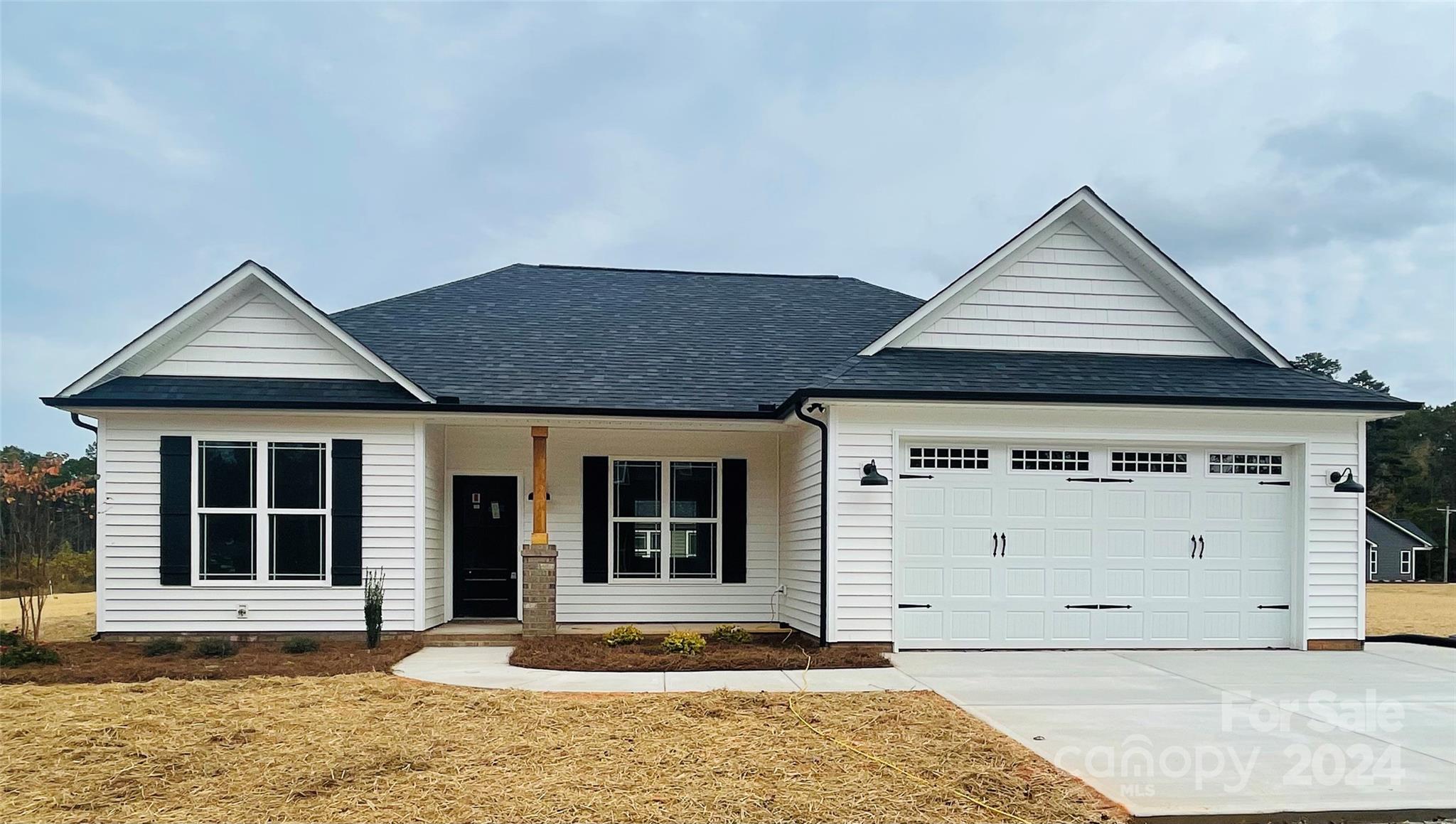 a front view of a house with a garage