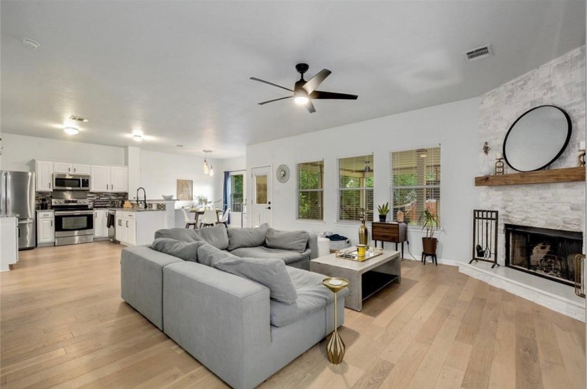 a living room with furniture and a fireplace