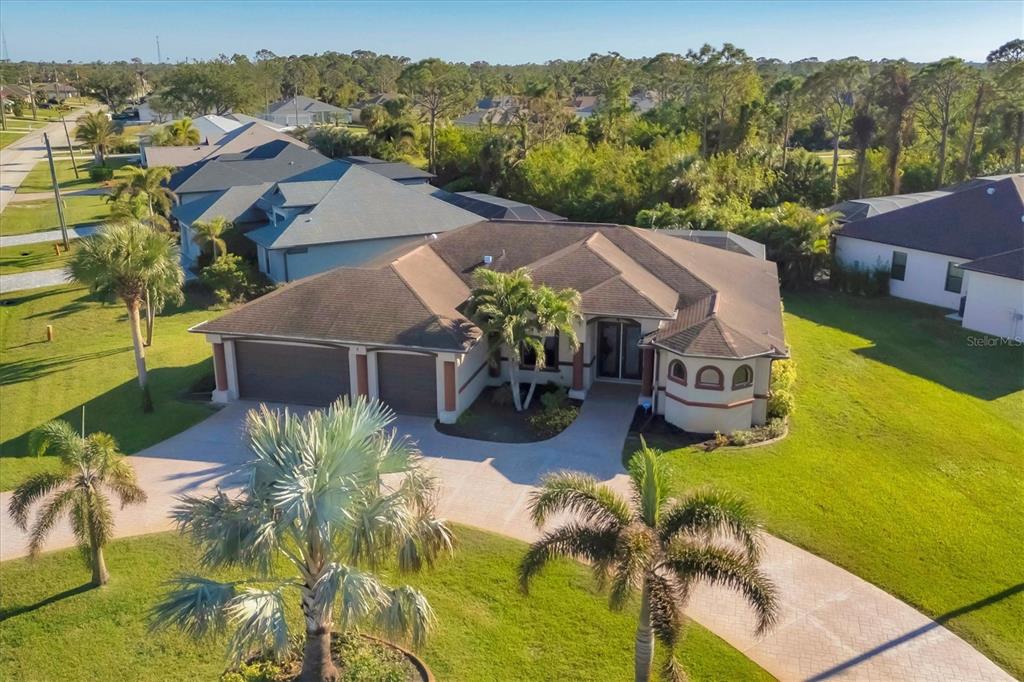 Oversized corner lot with paved circular driveway