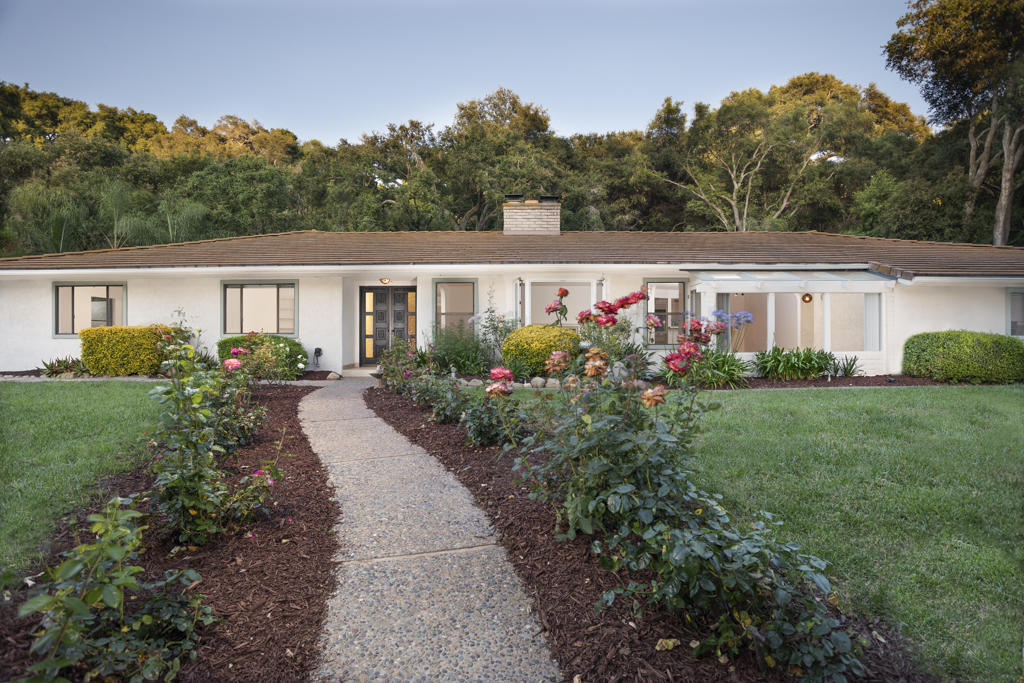 a house view with a garden space