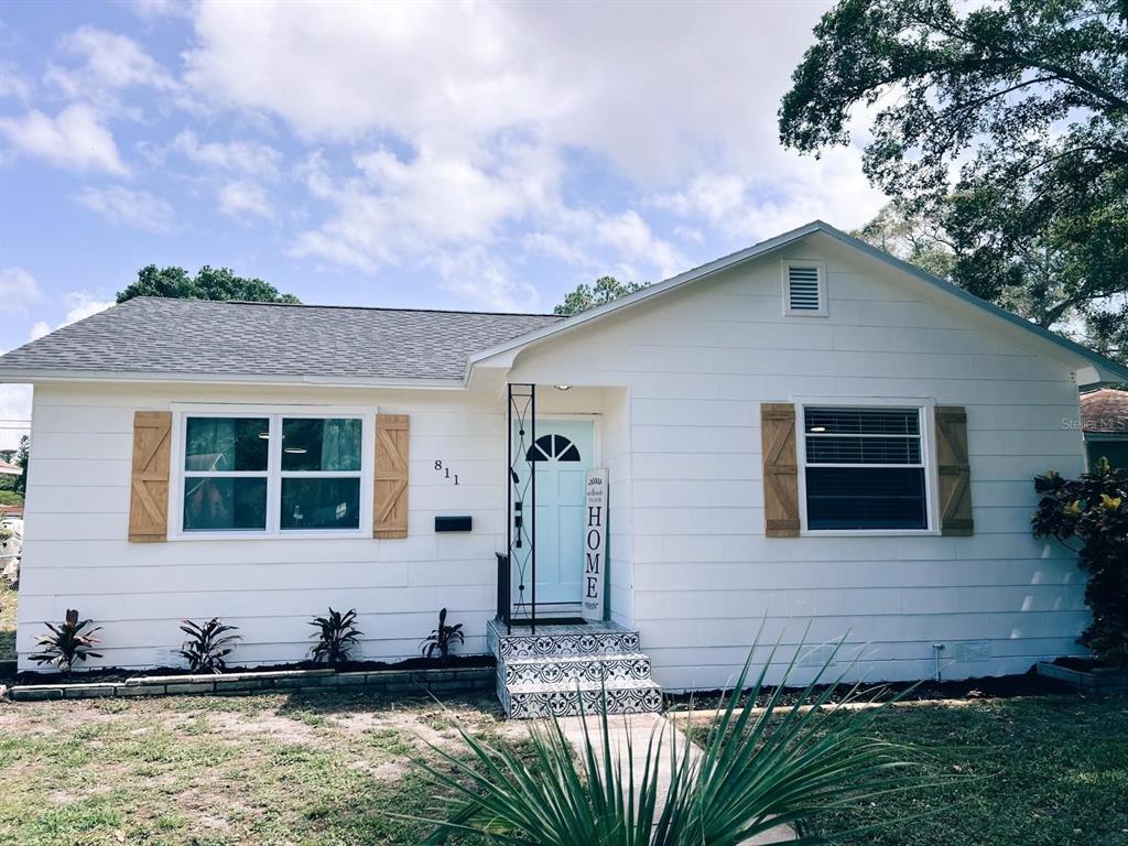 a front view of a house with a yard