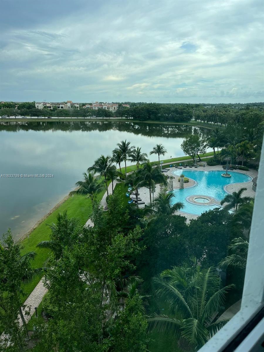 a view of a lake with houses in the back