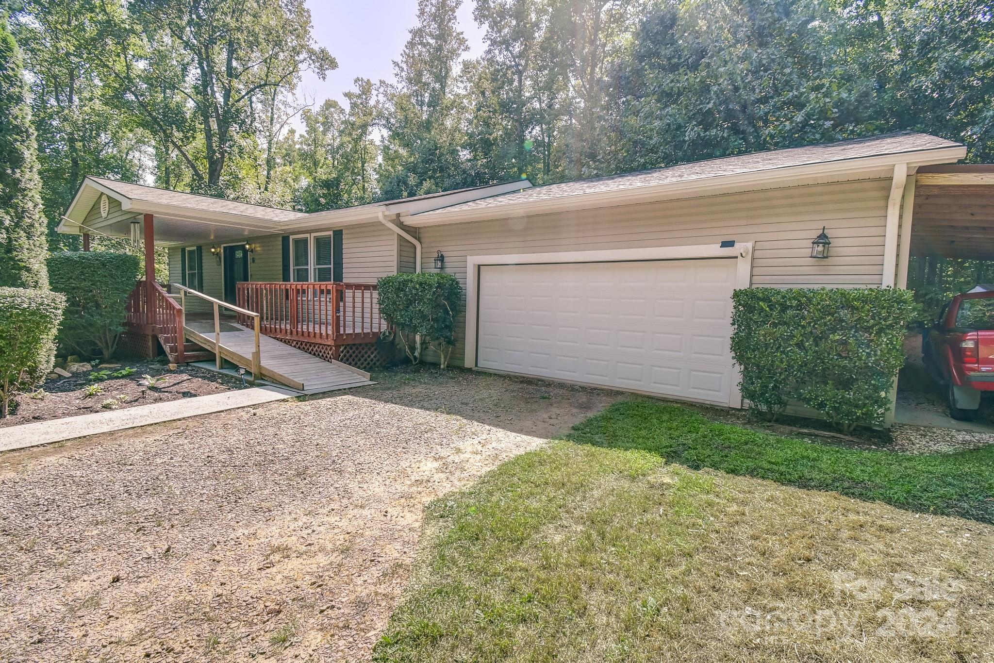 a view of a house with a backyard