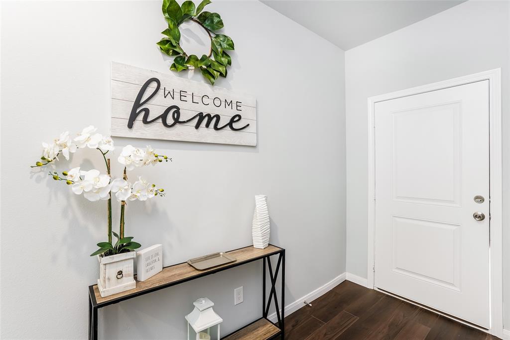 a room with a potted plant on the counter