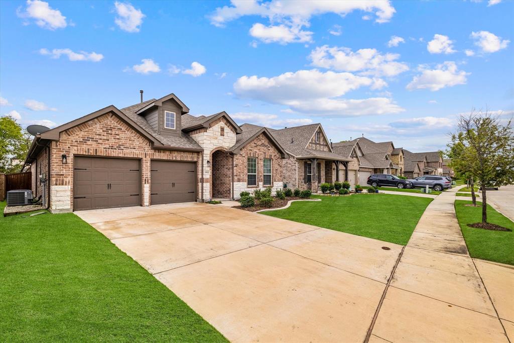 a front view of a house with yard