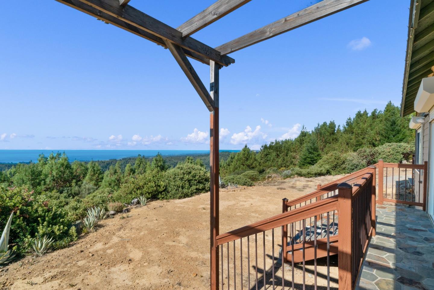 a view of a balcony with wooden fence