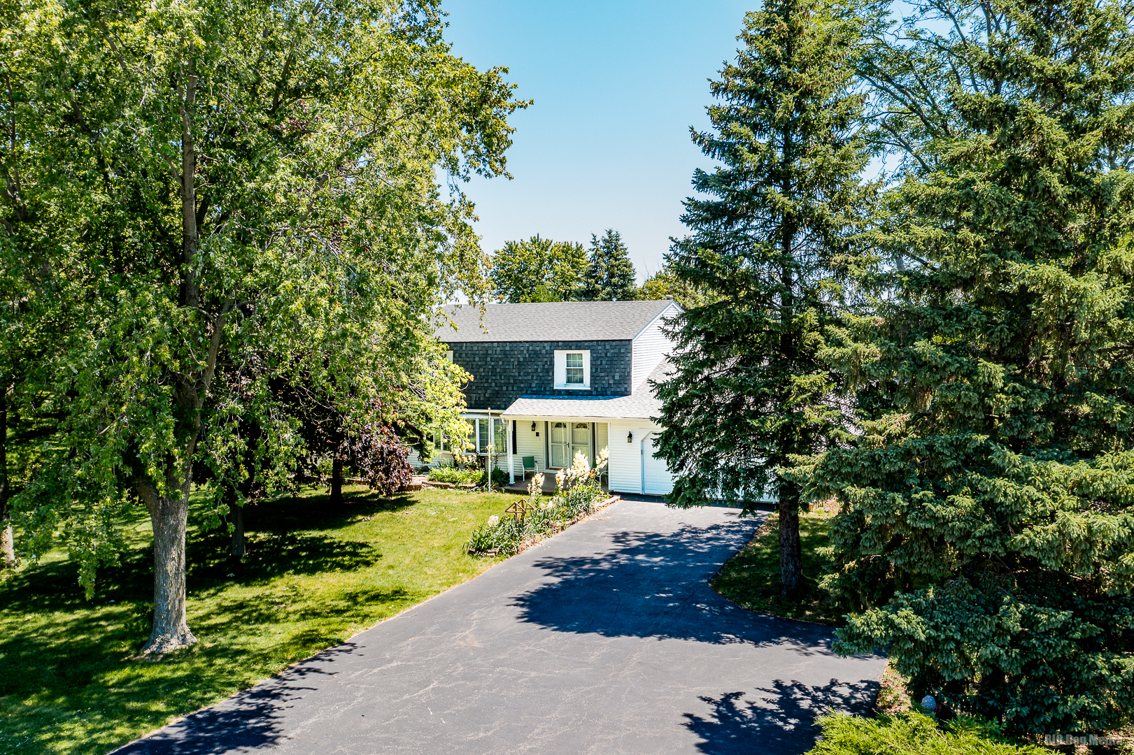 a view of house with yard