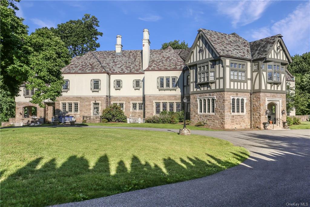 Enchanting grand stone Tudor on 2.18 acres