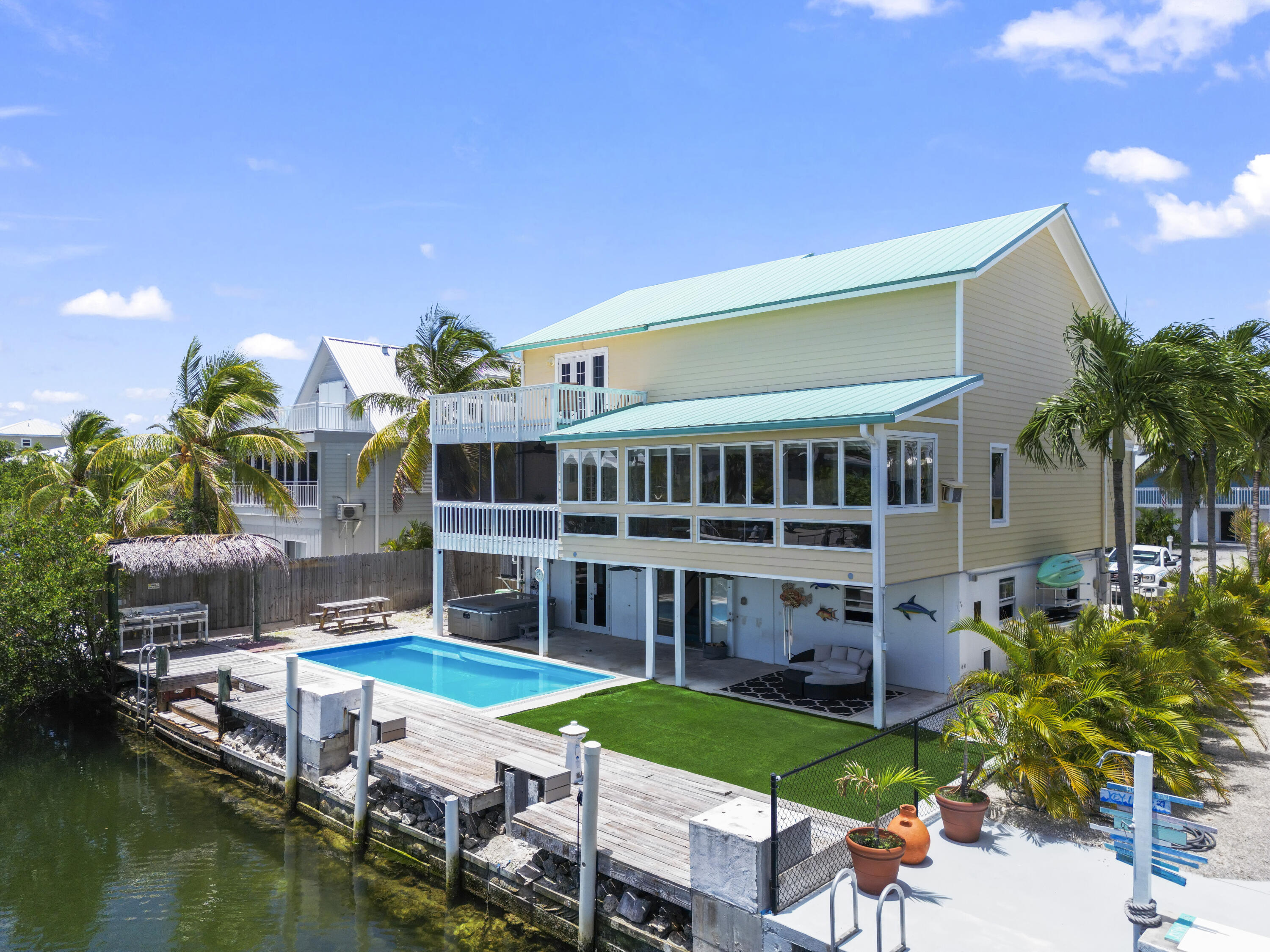 a house with swimming pool in front of it