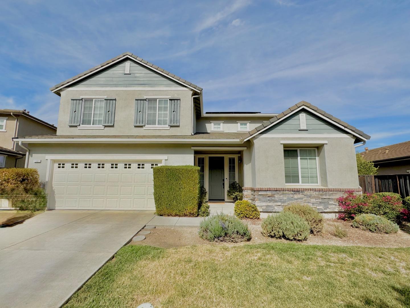 a front view of a house with a outdoor space