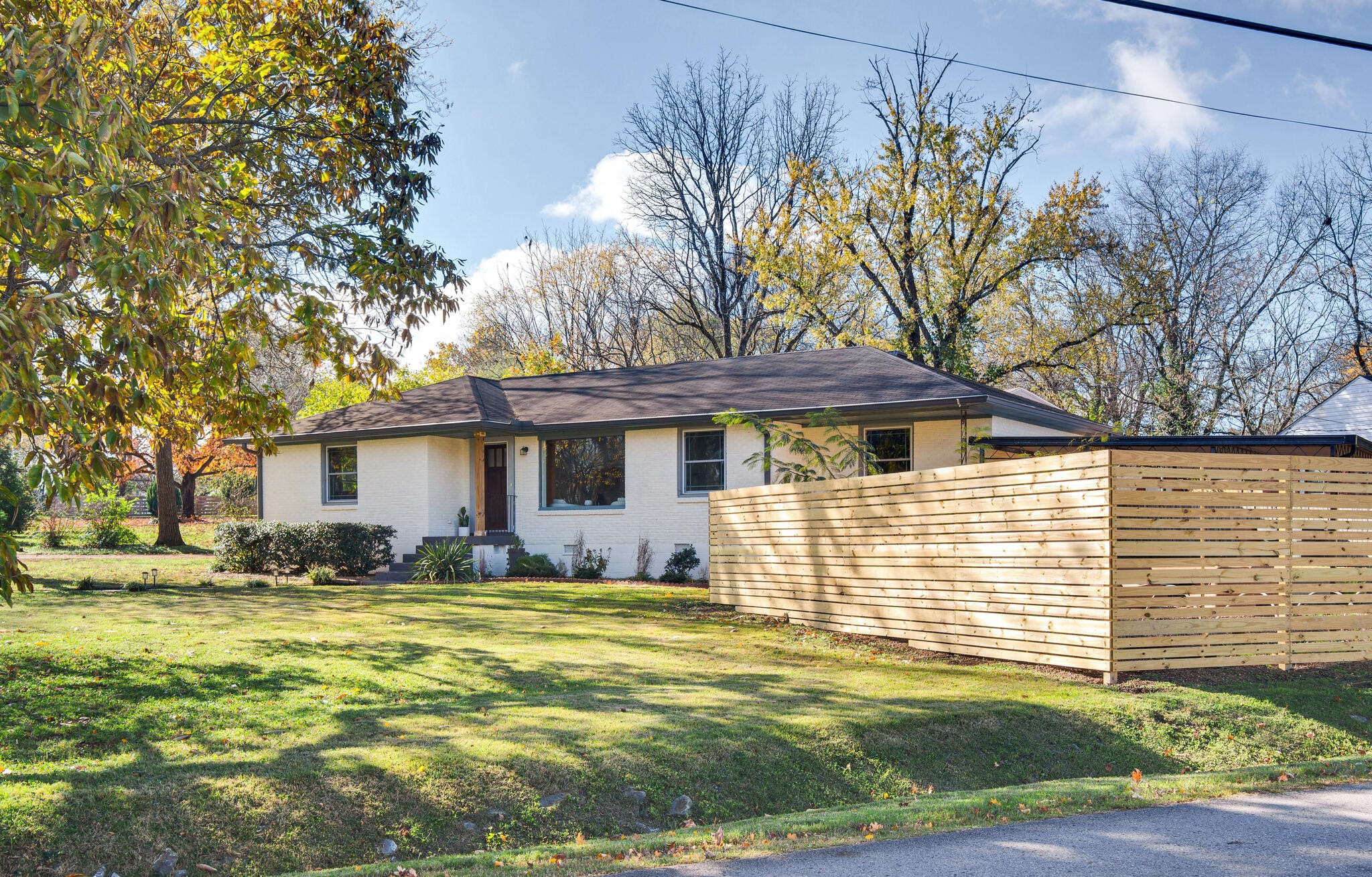 a front view of a house with a yard