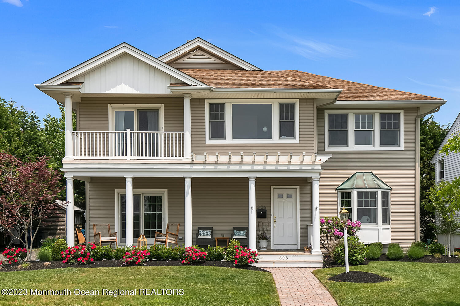 front view of a house with a yard