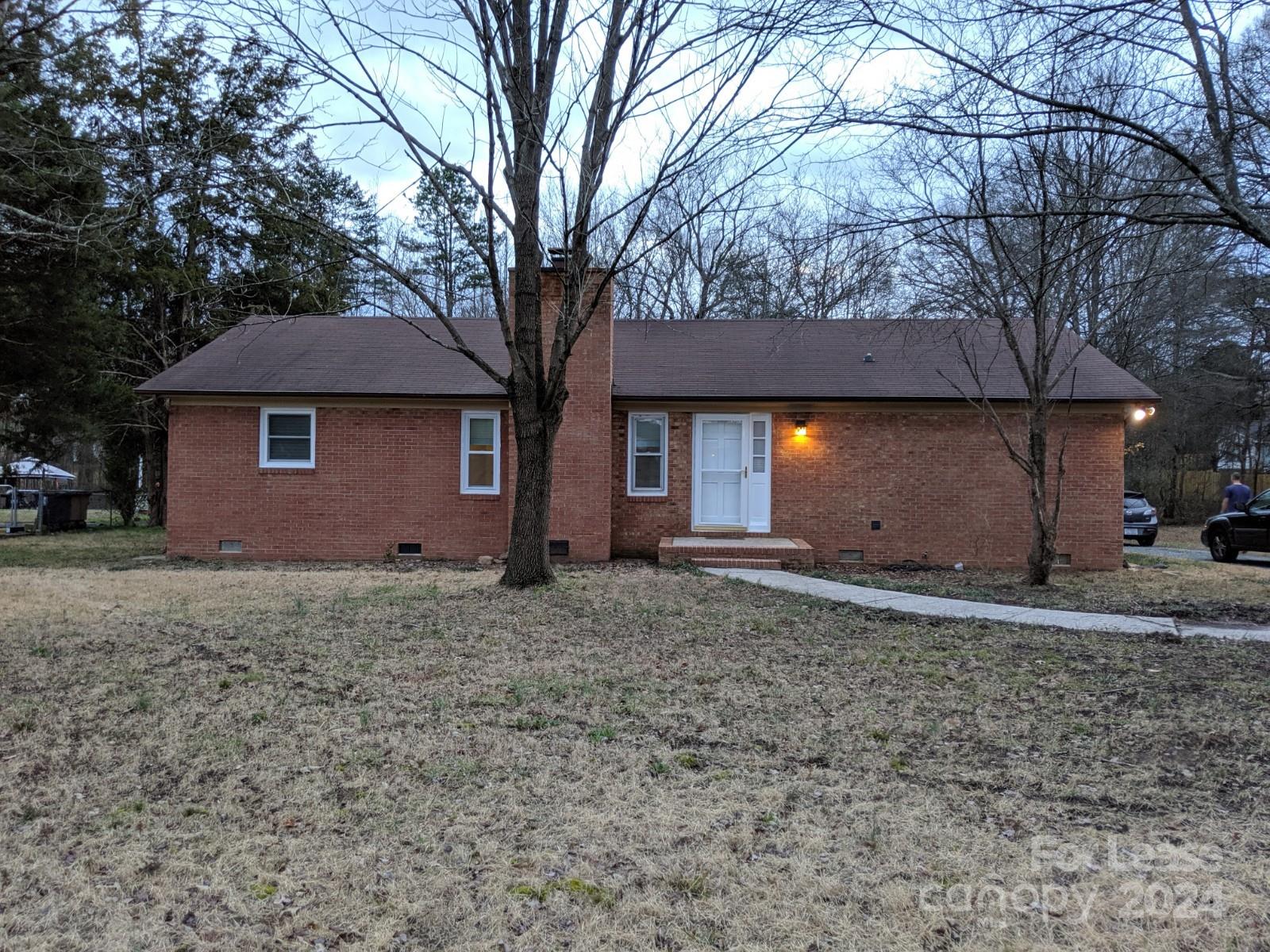 a house with trees in front of it