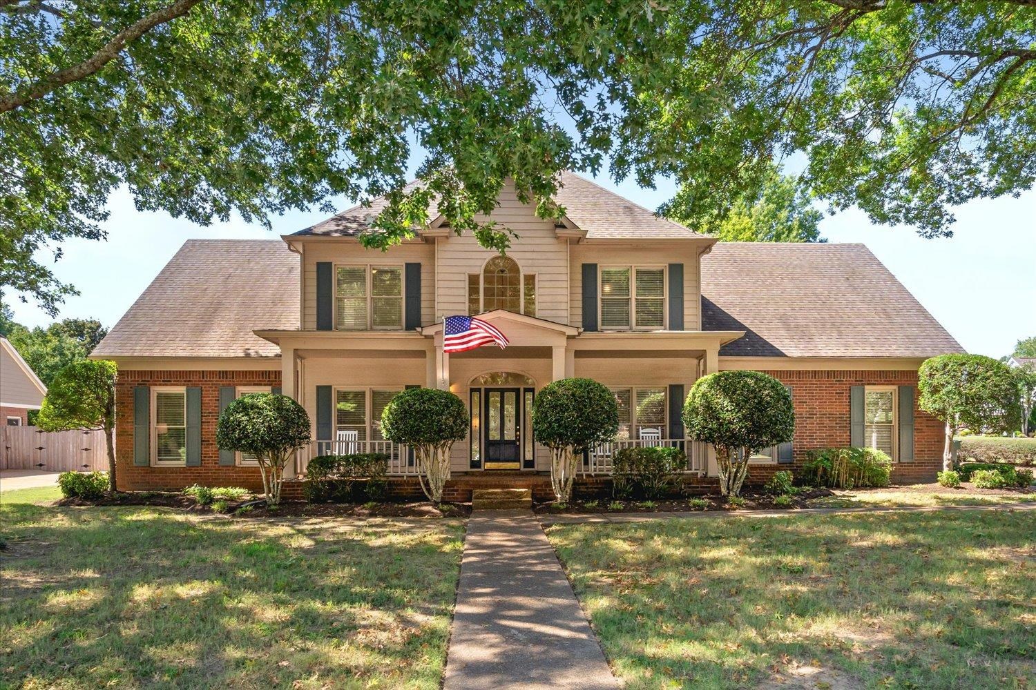 front view of a house with a yard