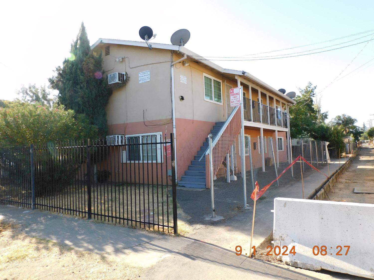 a front view of house with sign board