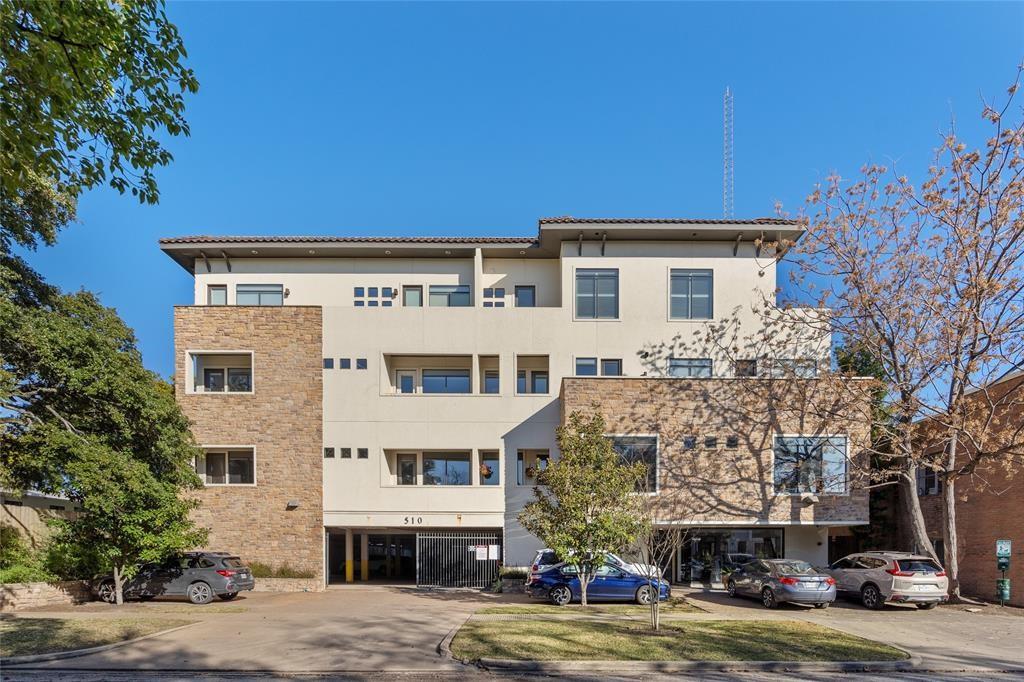 a front view of a building with garden