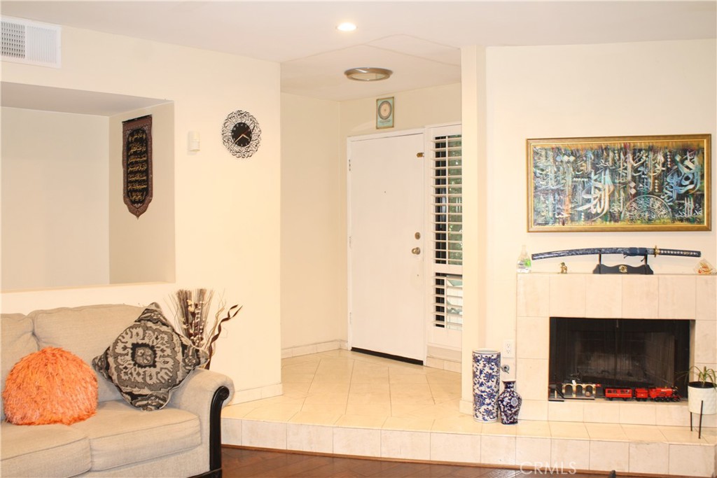 a view of a livingroom with furniture and a fireplace