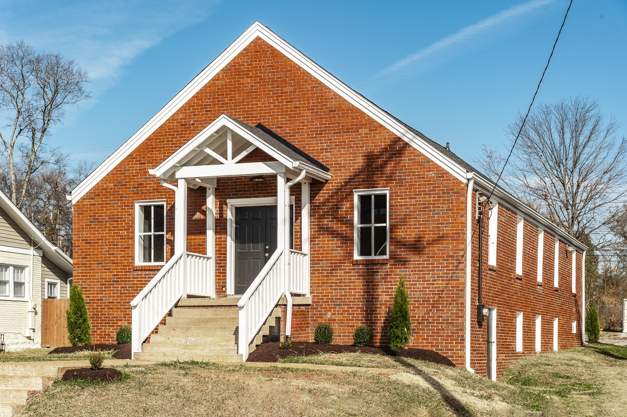 a front view of a house with a yard