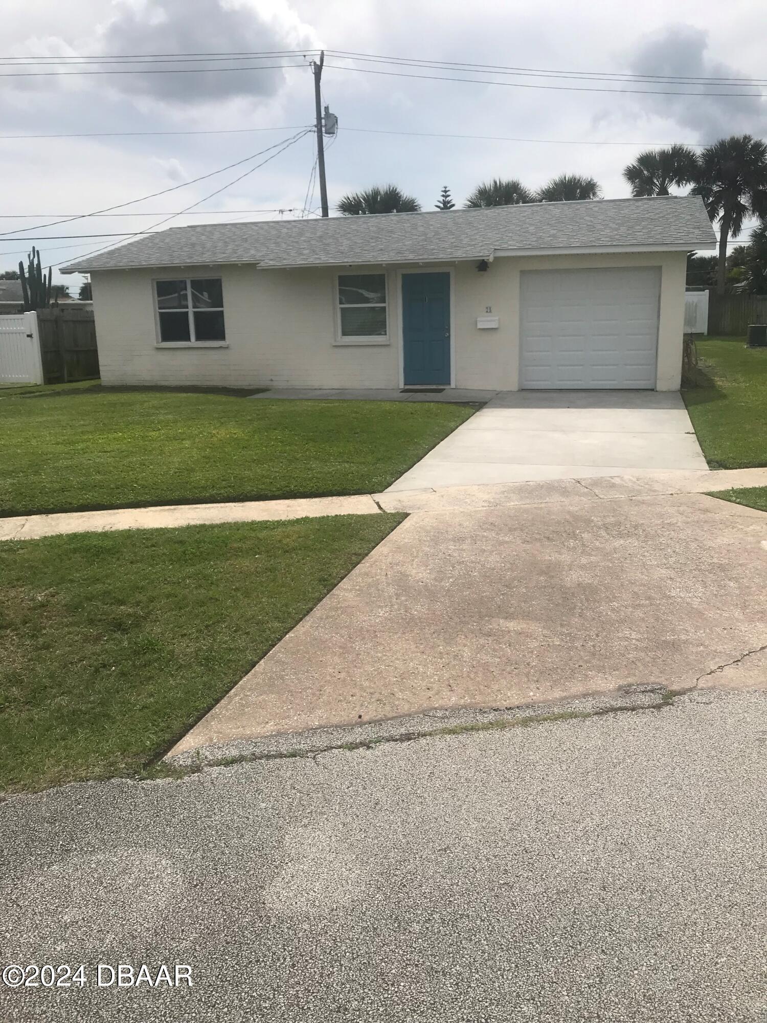 a front view of a house with yard