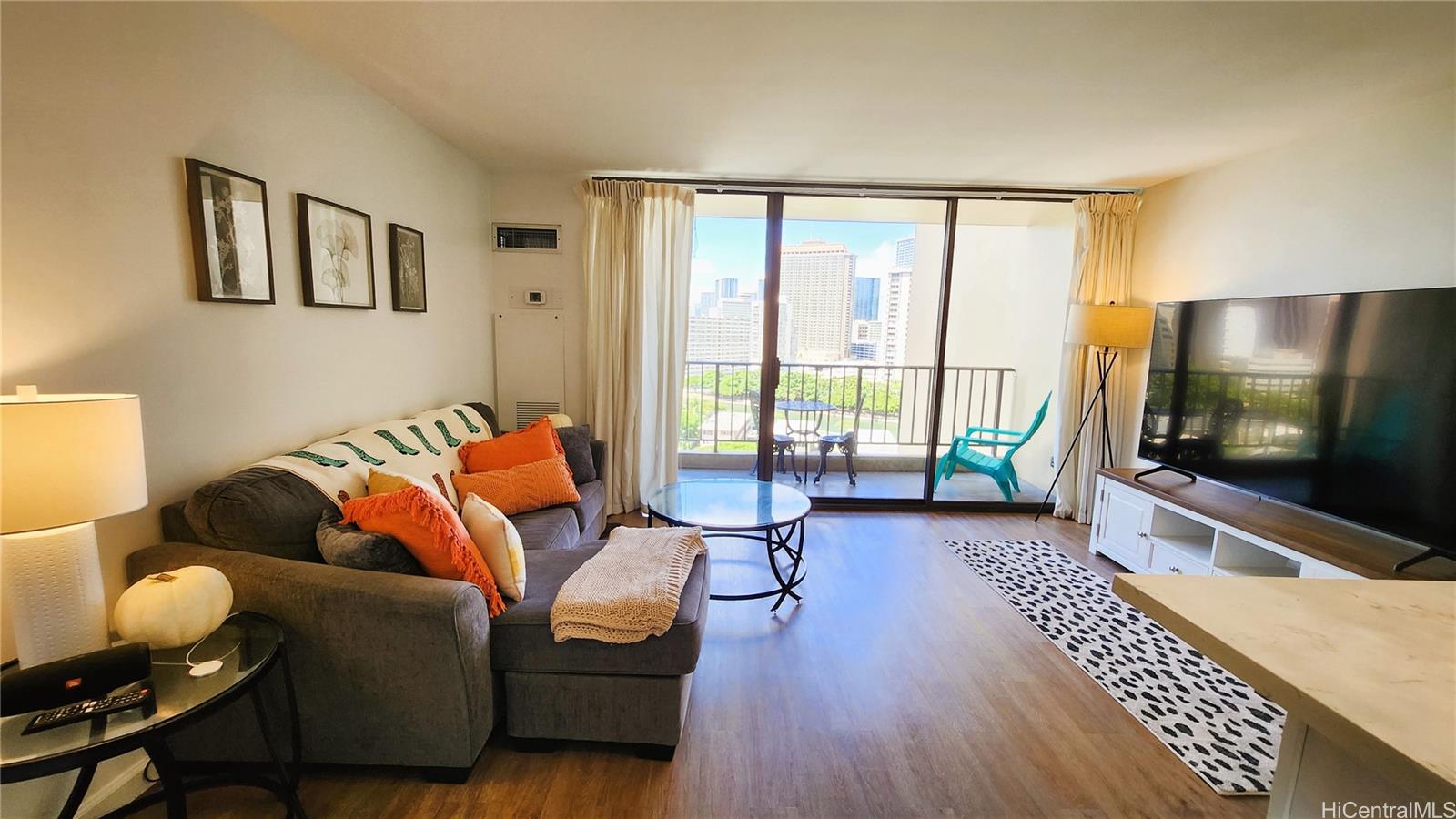 a living room with furniture and a flat screen tv