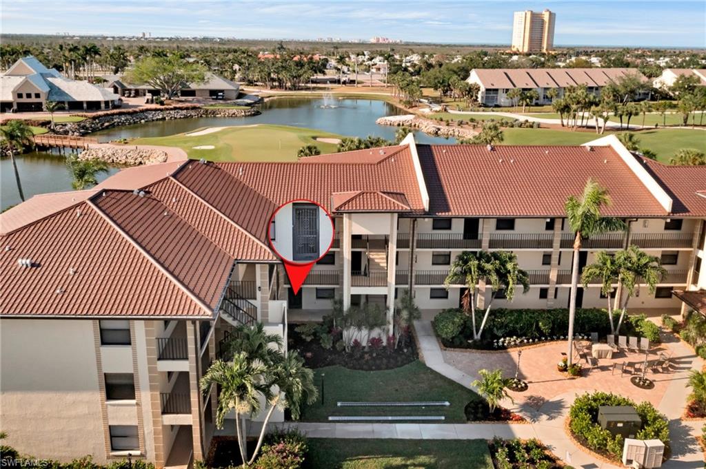 an aerial view of houses and lake