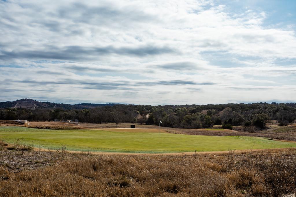 a view of a golf course with a big yard