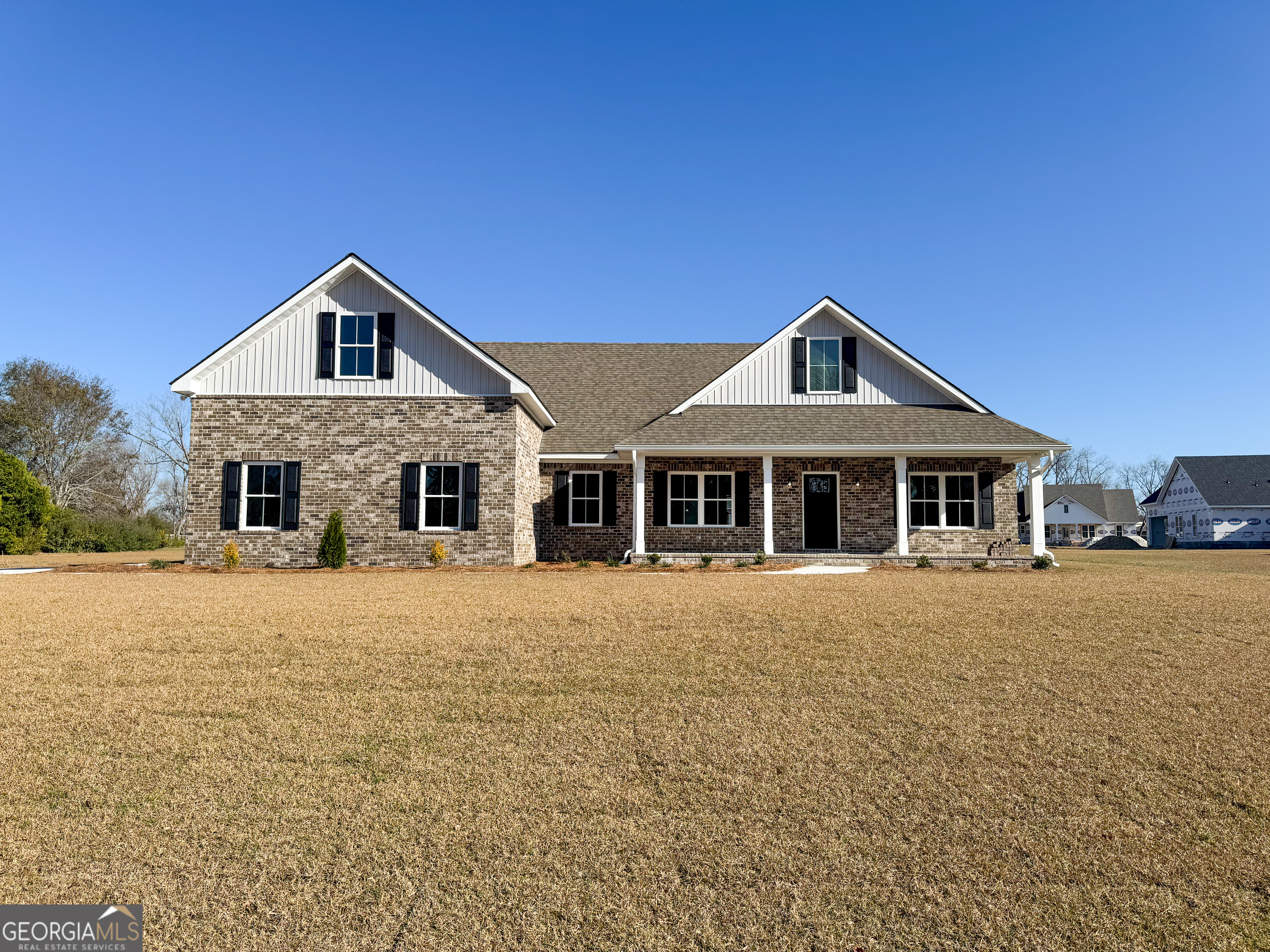 a front view of a house with yard