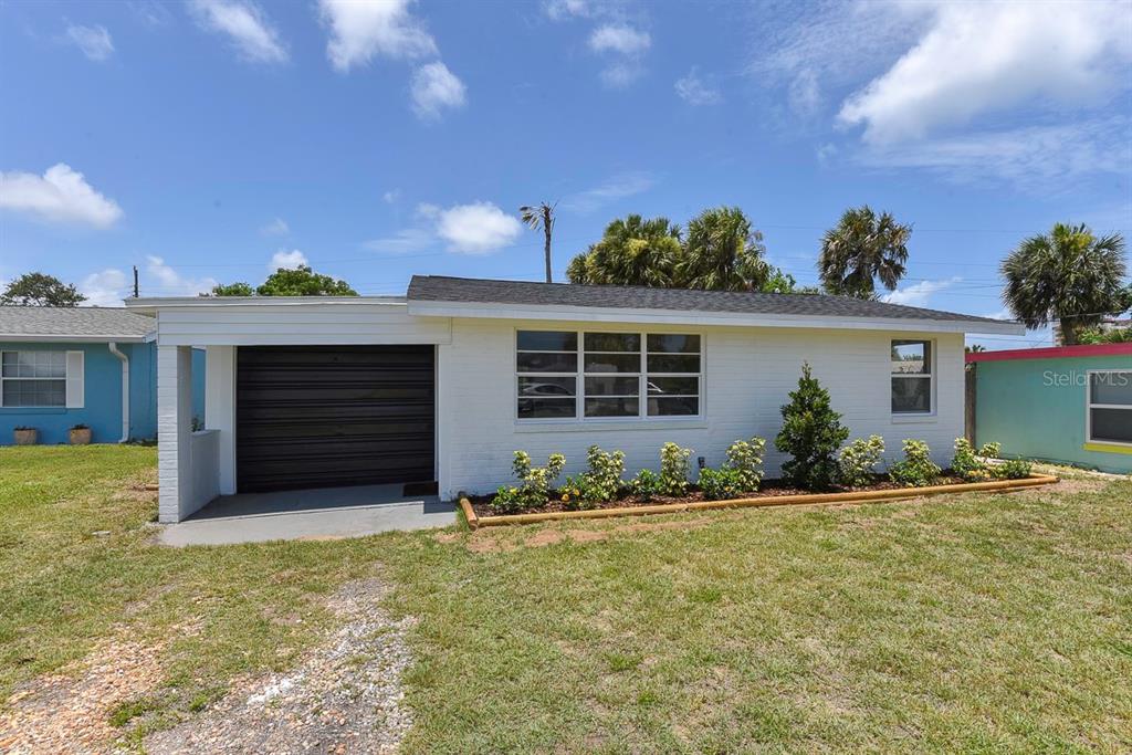 front view of a house with a yard