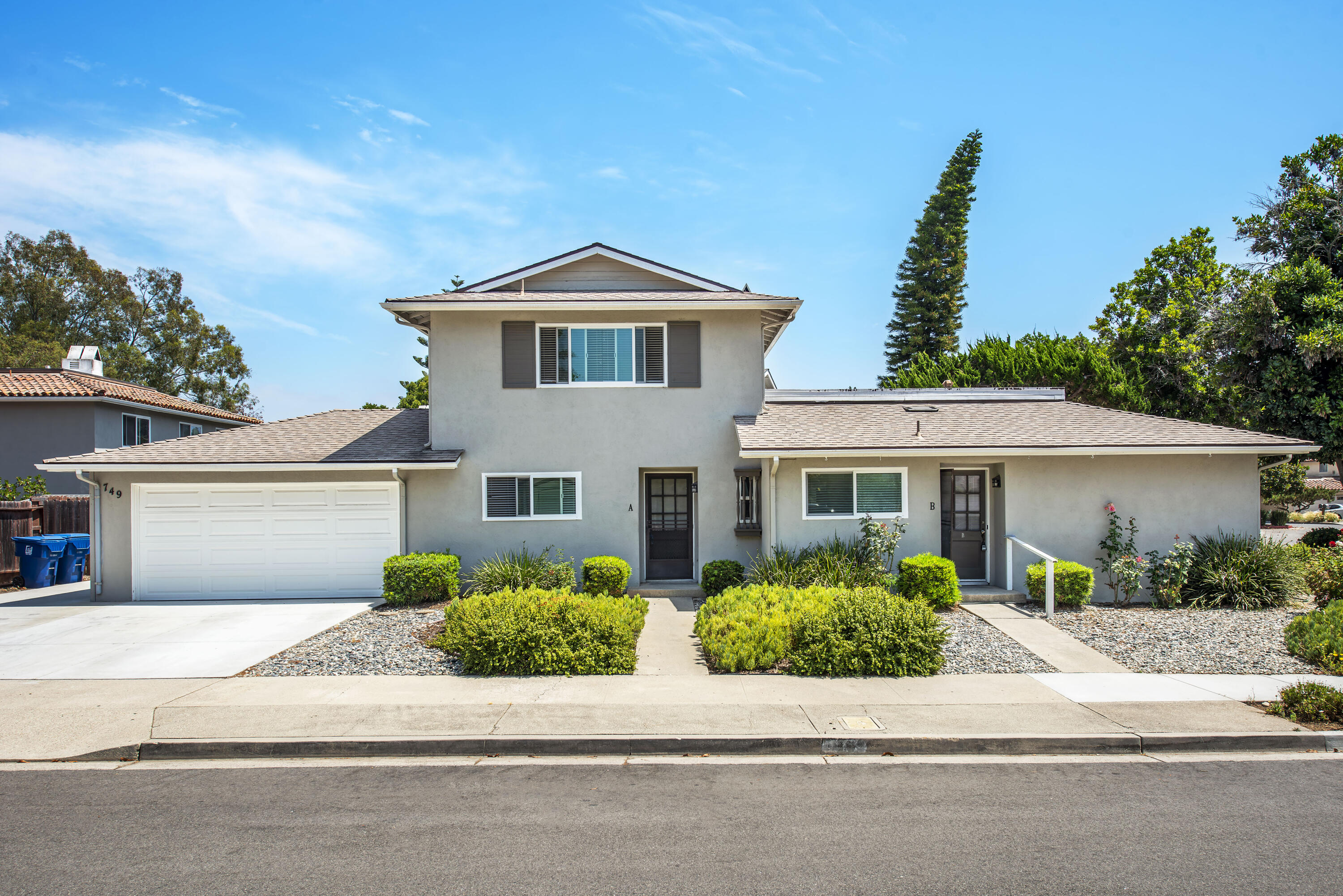 front view of a house with a yard