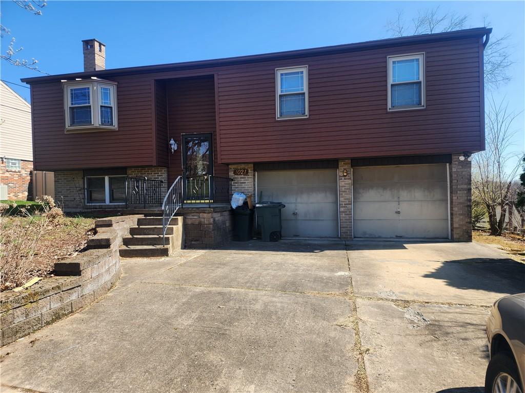 a front view of a building with garage