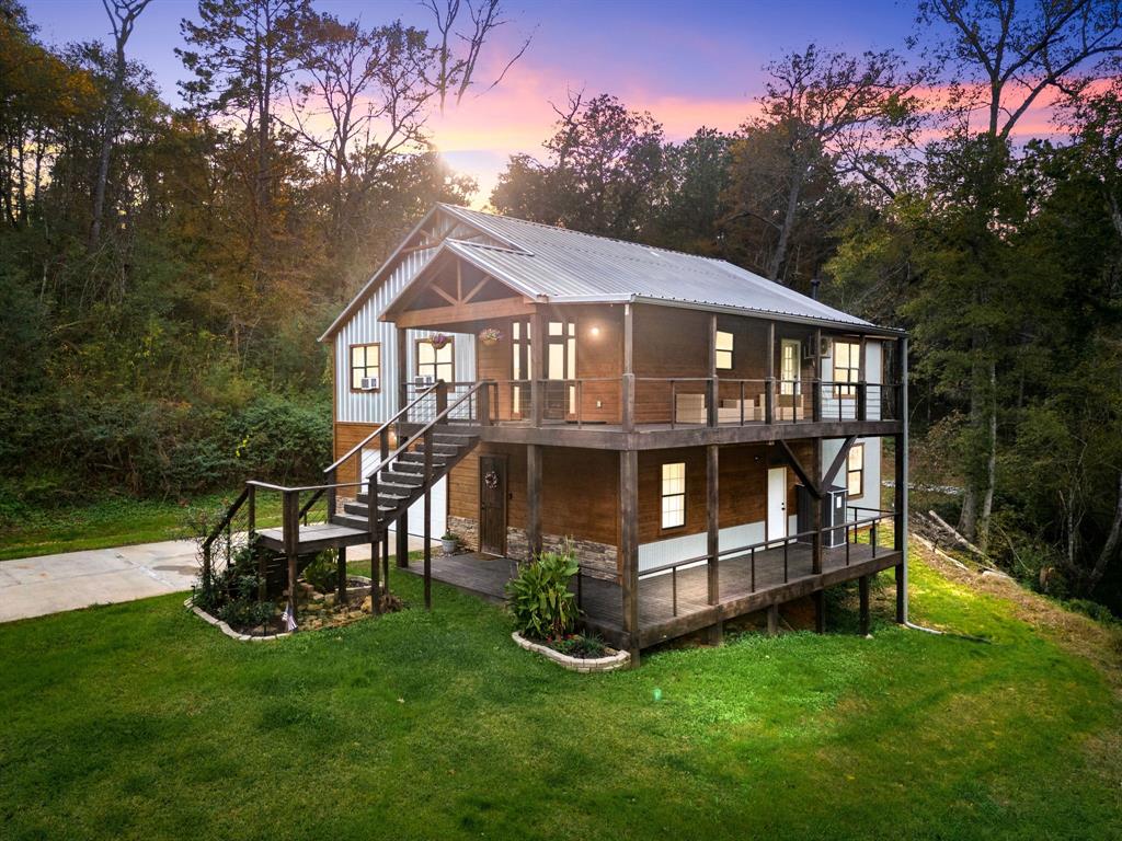 a view of a house with a yard porch and sitting area