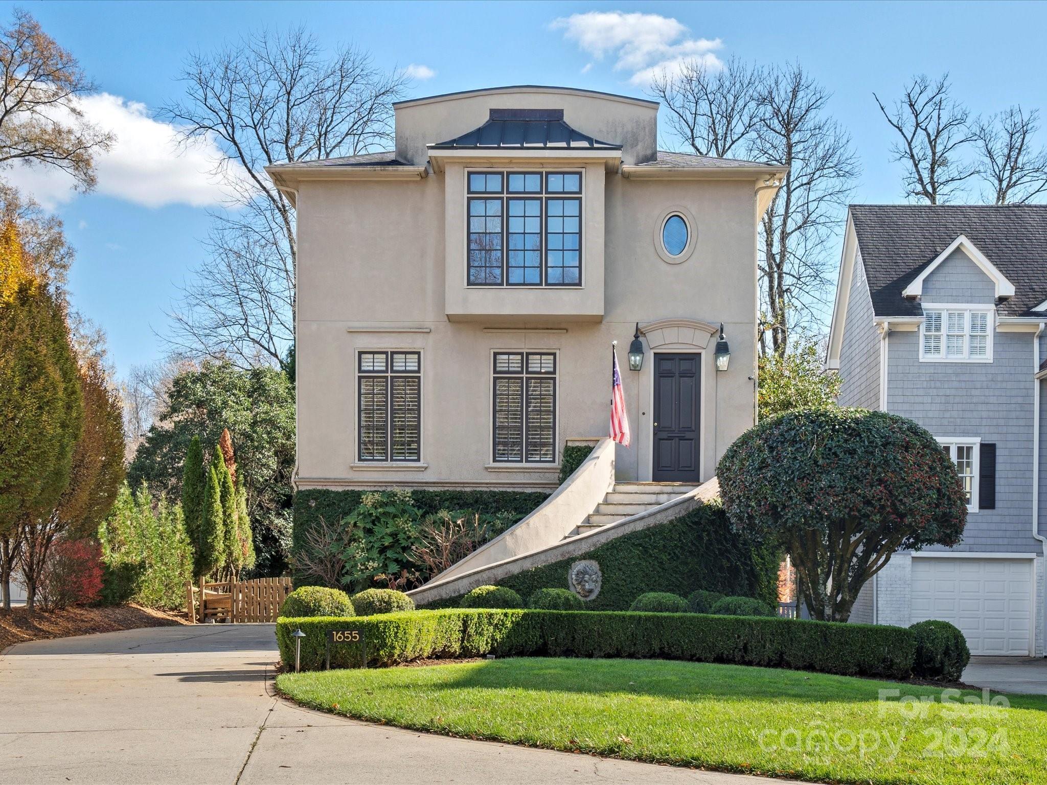 a front view of a house with garden