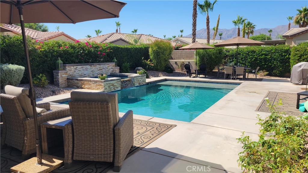 a view of a swimming pool with a patio