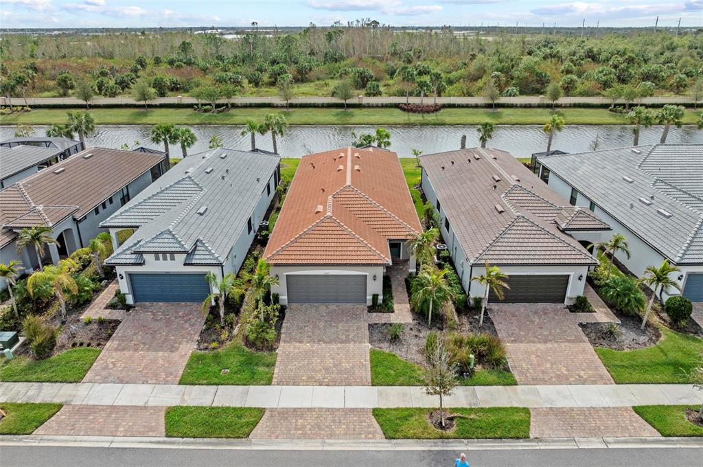 an aerial view of a house with a lake view