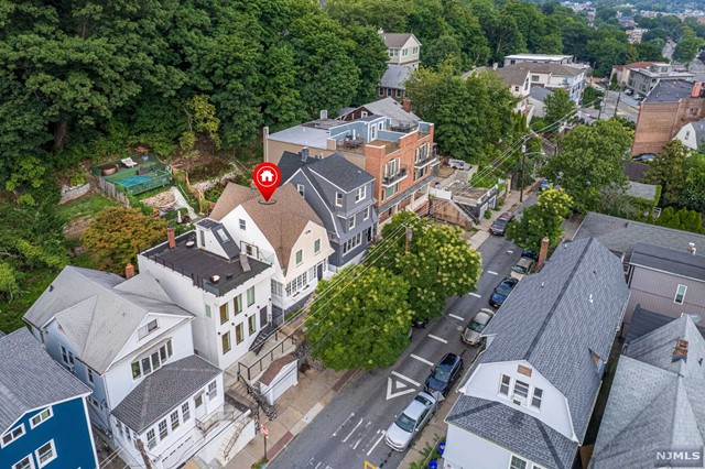 an aerial view of a house with outdoor space