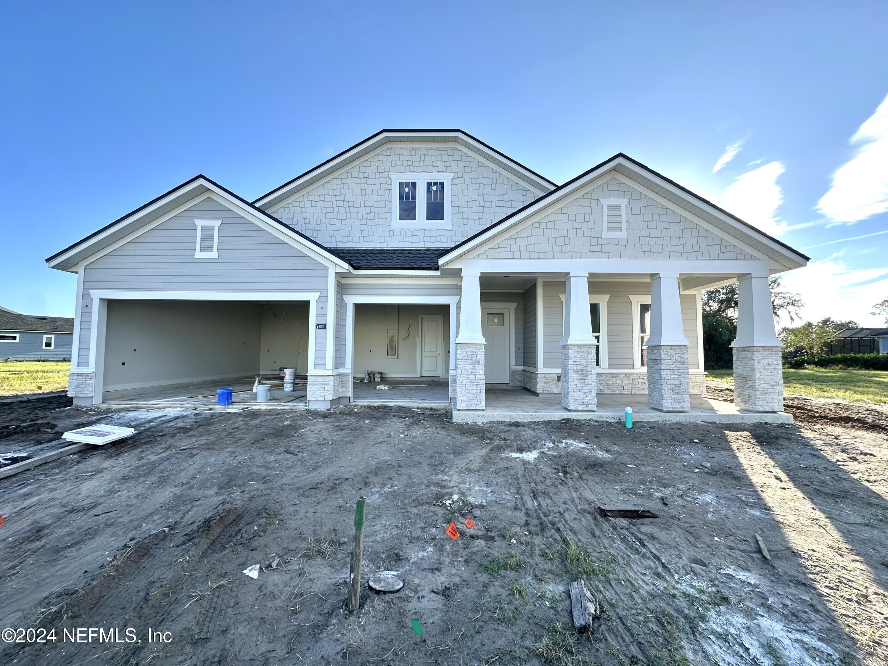 a front view of a house with yard