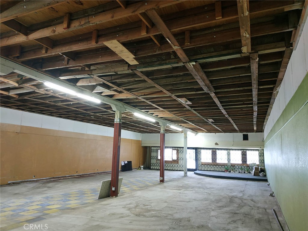 a view of an empty room with wooden walls