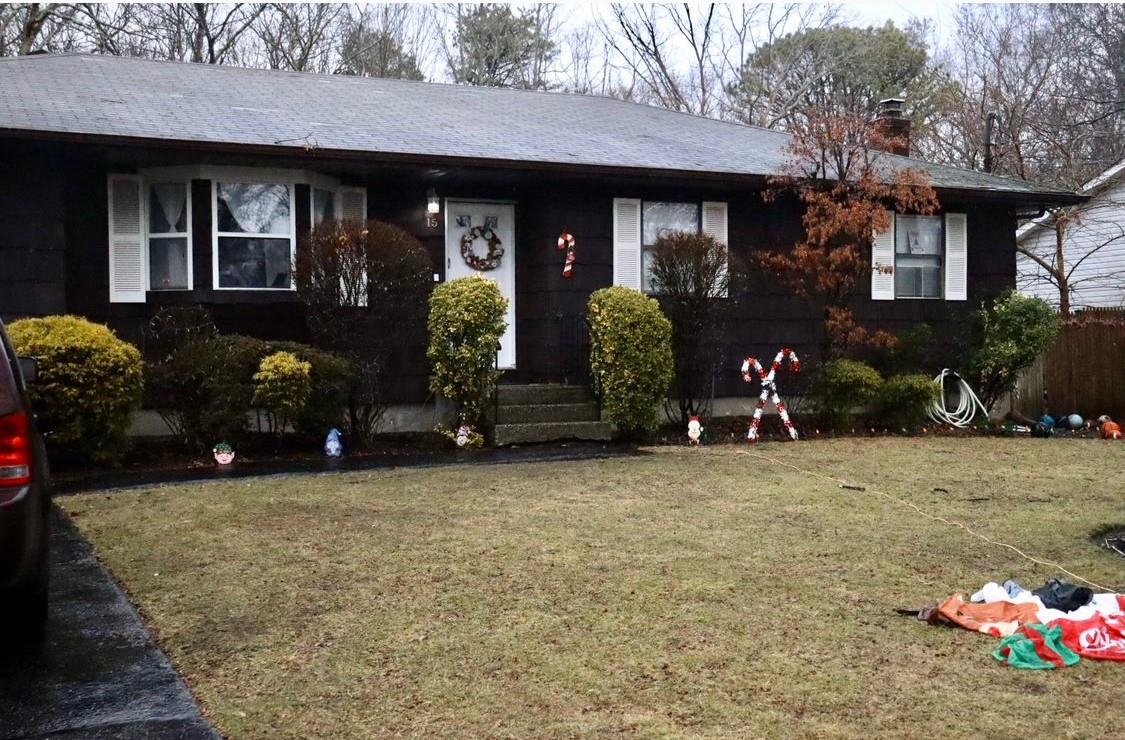 a view of a house with many windows and yard