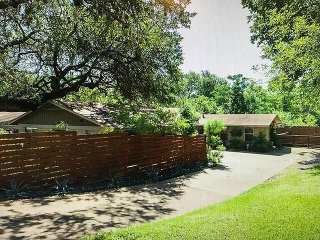 a view of house with yard