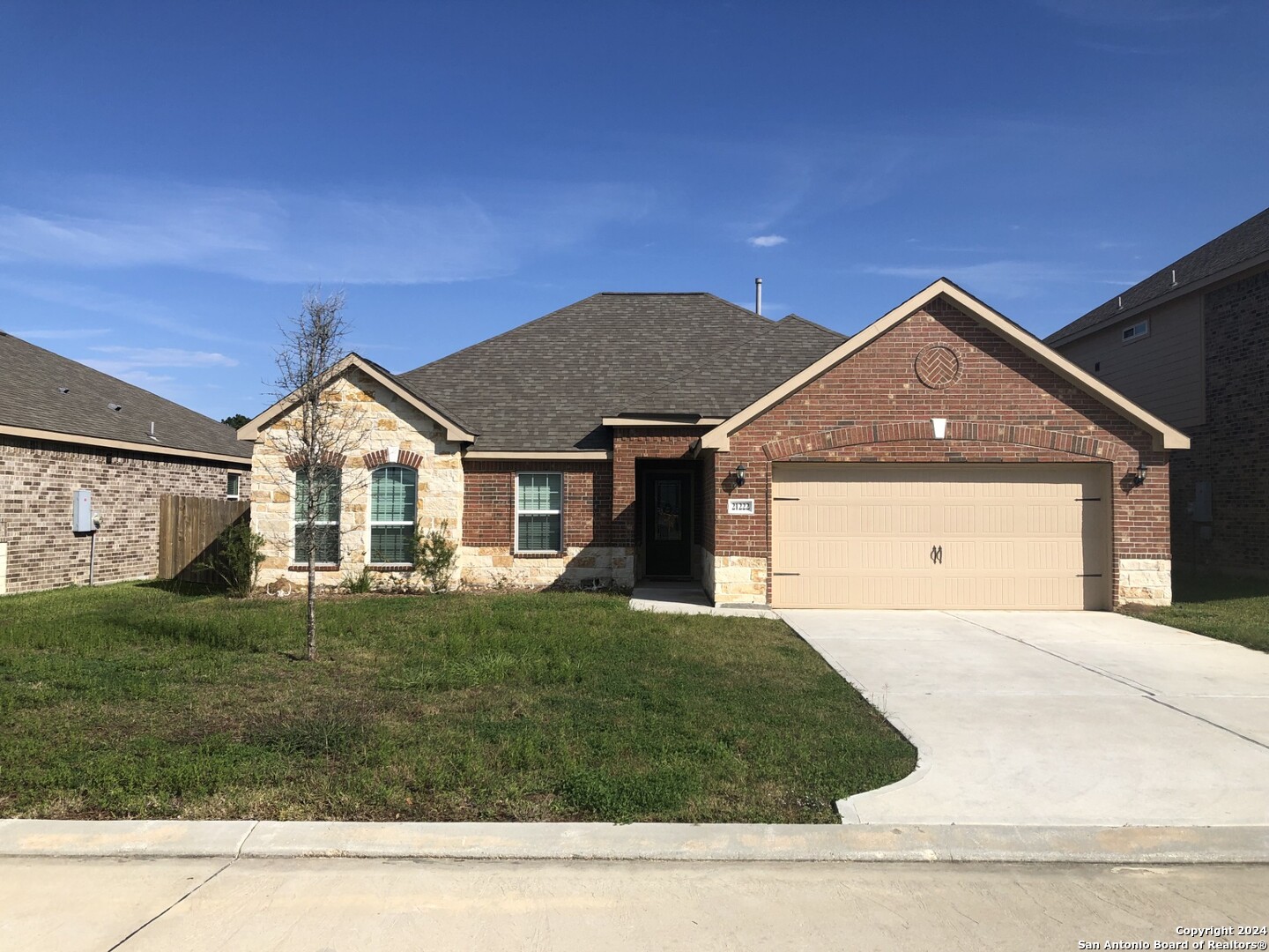 a front view of a house with a yard