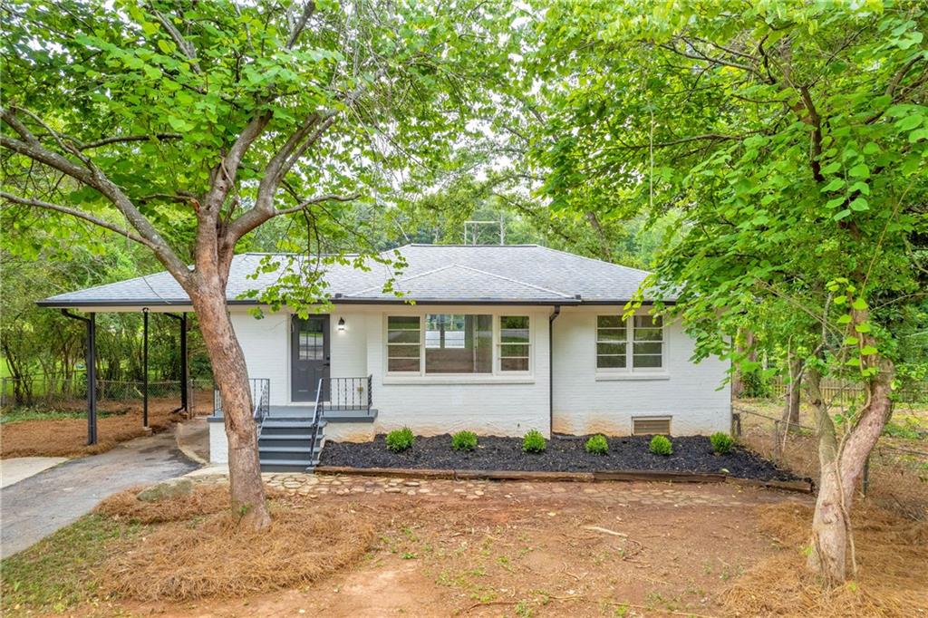 front view of a house with a yard