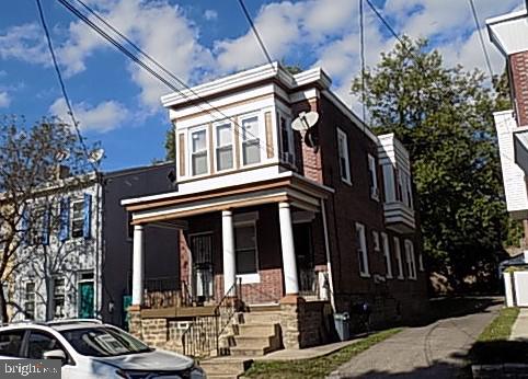 a front view of a building with street view