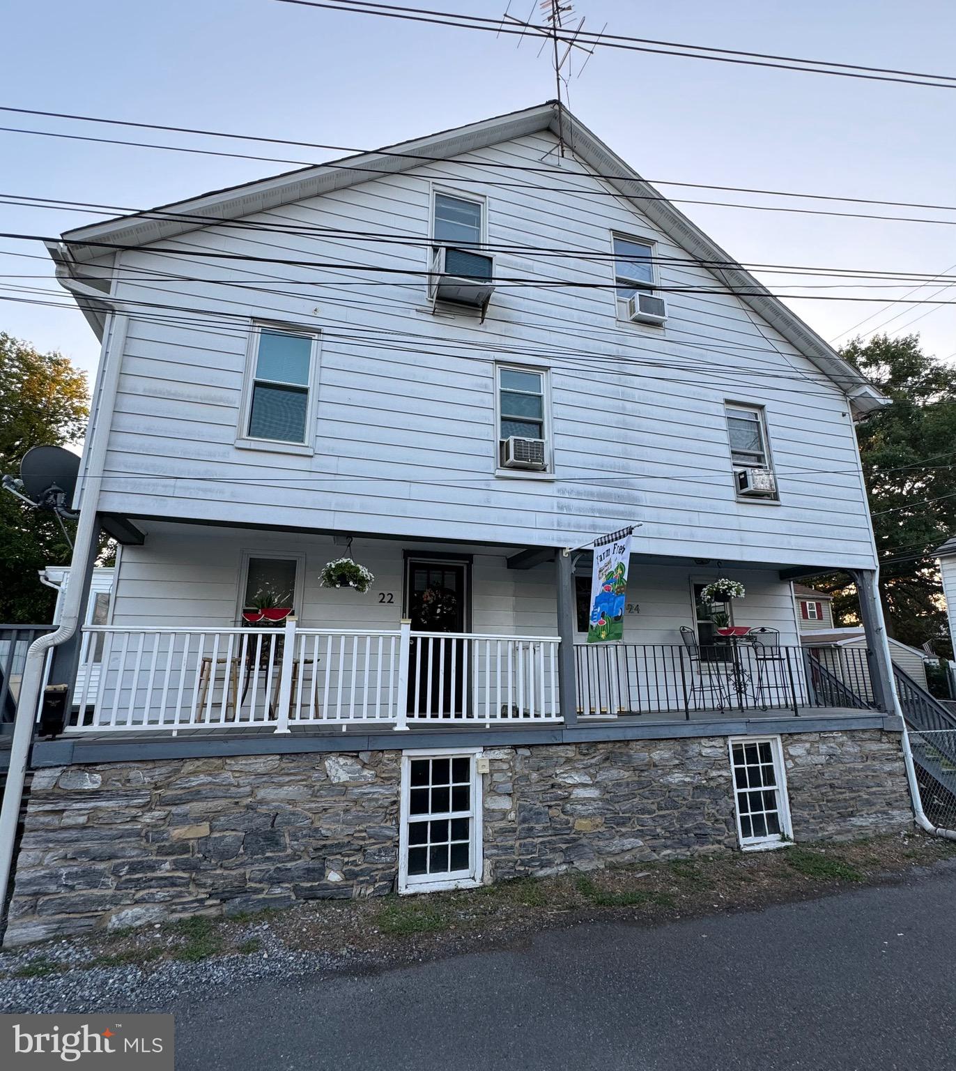 a front view of a house with a porch