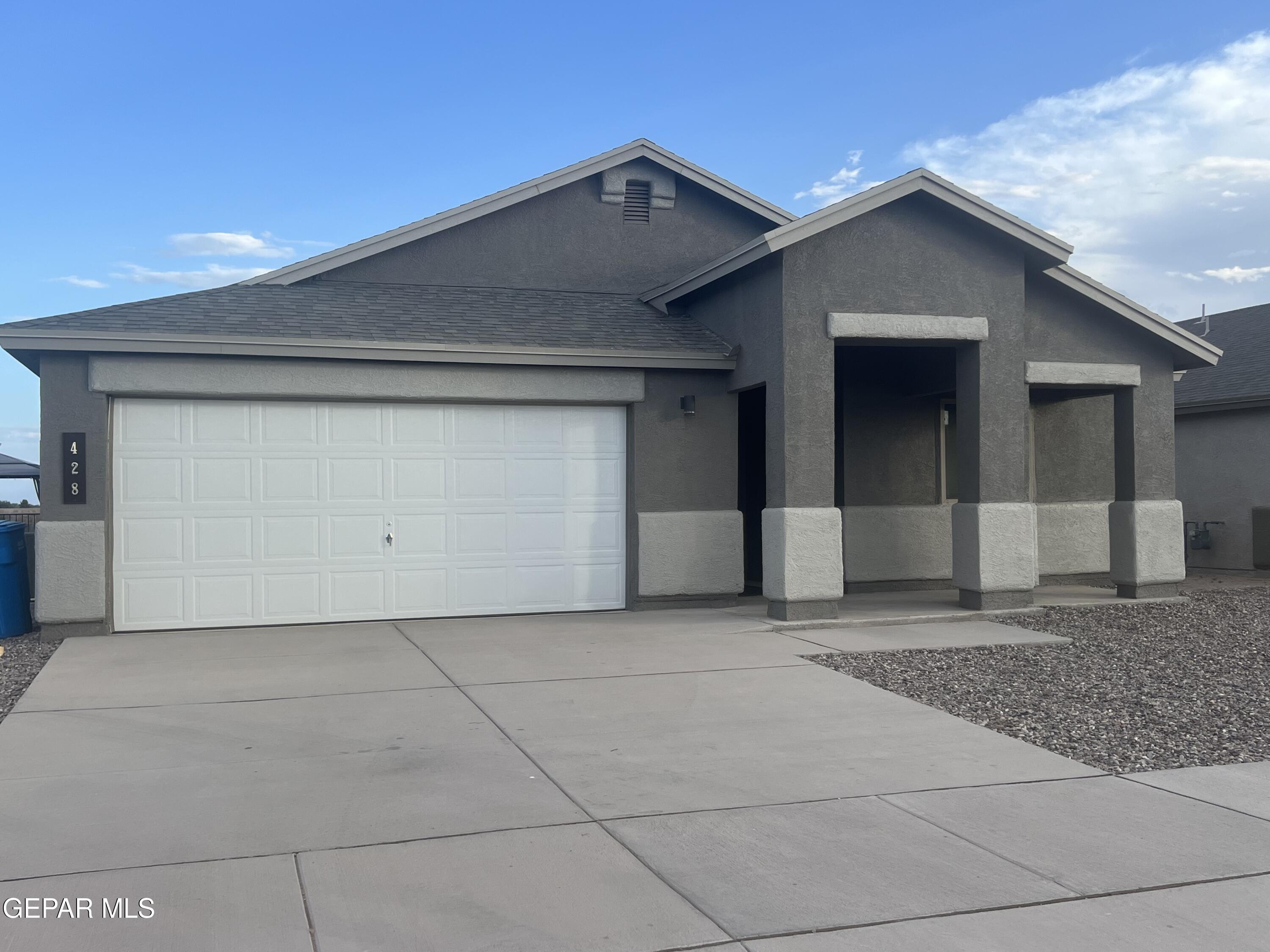 a view of a house with garage