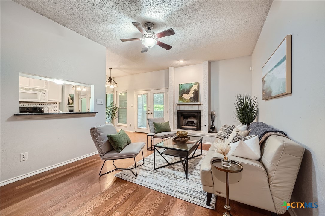 a living room with furniture fireplace and a fireplace