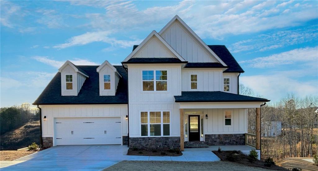 a front view of a house with garage