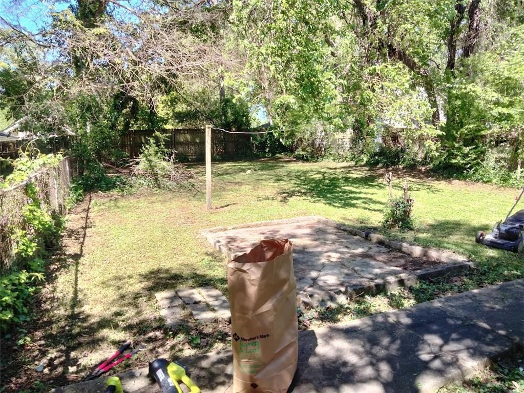 a view of yard with swimming pool