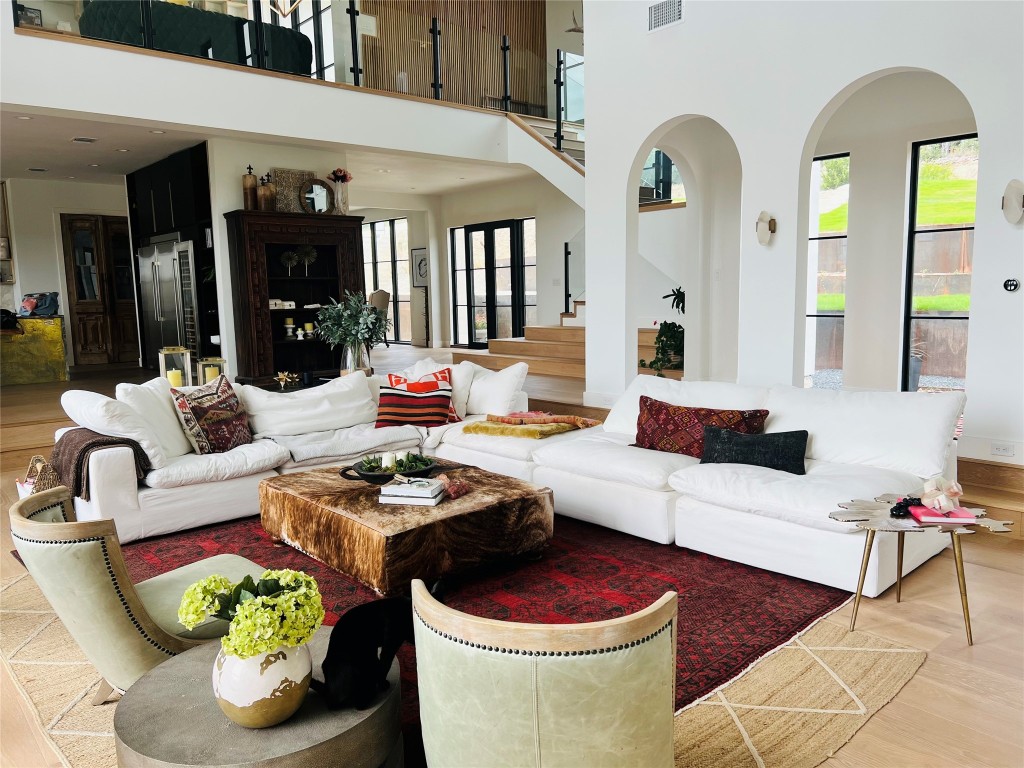 a living room with furniture and a potted plant