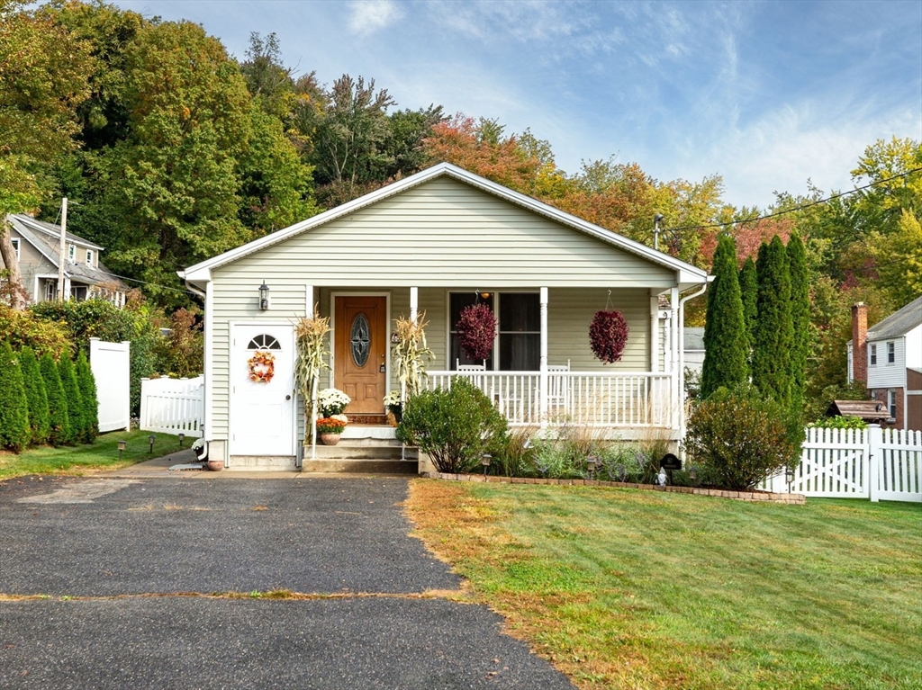 a front view of a house with a yard